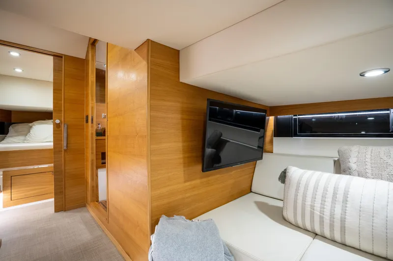 Slide: The Image of Luxurious interior of 2023 De Antonio Yachts D42 Open with modern wood finish and cozy seating. - 21