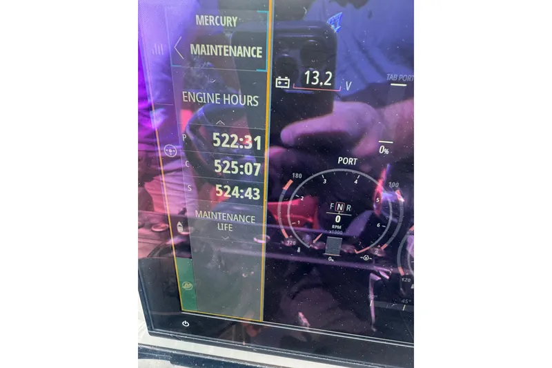 Slide: The Image of Display screen of 2022 De Antonio Yachts D42 Open showing engine hours and maintenance data. - 25