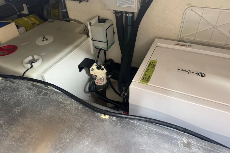 Slide: The Image of Engine compartment of 2022 De Antonio Yachts D42 Open, showcasing mechanical components and wiring. - 26