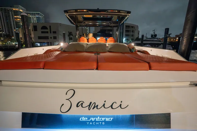 Slide: The Image of 2023 De Antonio Yachts D42 Open with luxurious deck and cityscape backdrop. - 9
