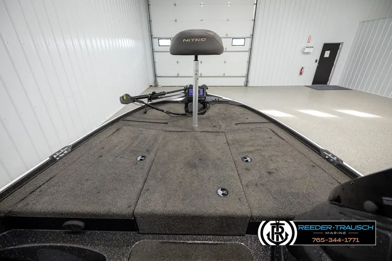 Slide: The Image of 2021 Ntiro Z17 boat interior with fishing deck and trolling motor in a showroom. - 18