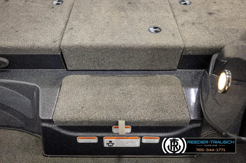 Slide: The Image of Carpeted deck of a 2021 Ntiro Z17 boat with safety labels and logo. - 20