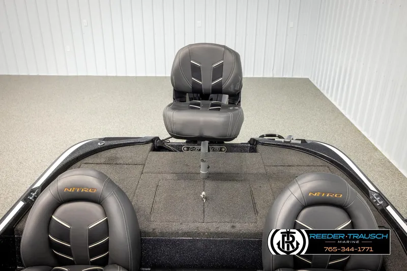 Slide: The Image of 2021 Ntiro Z17 boat interior with gray seats and Reeder-Trausch Marine logo. - 22