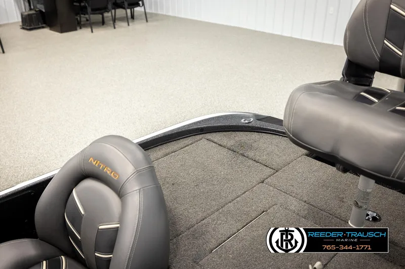Slide: The Image of Interior of a 2021 Ntiro Z17 boat with gray seating and carpeted flooring. - 24