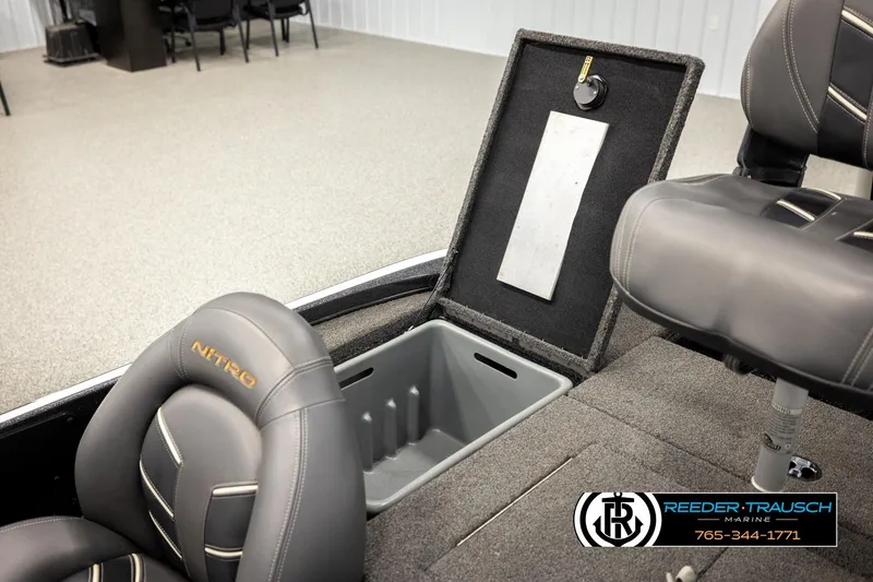 Slide: The Image of 2021 Ntiro Z17 boat interior with storage compartment and seating, Reeder Trausch Marine logo visible. - 25