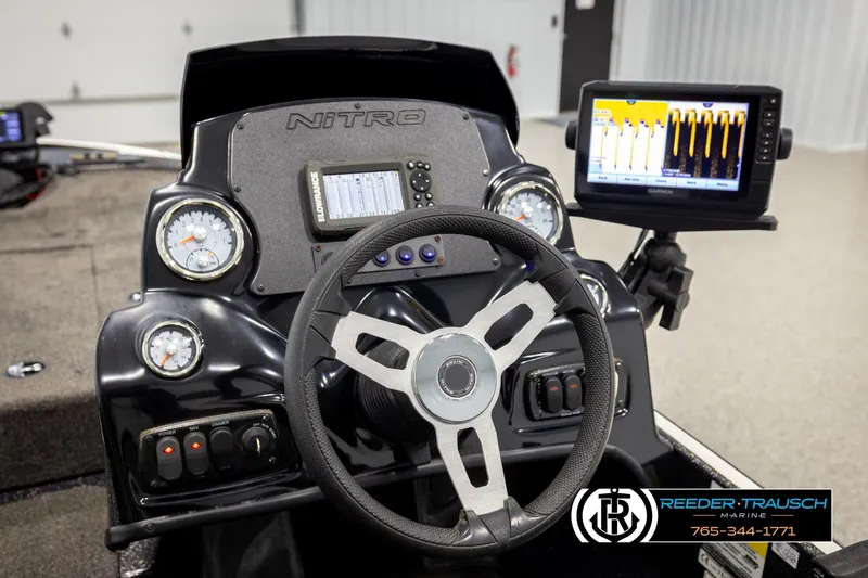 Slide: The Image of Steering console of a 2021 Ntiro Z17 boat with gauges and navigation display. - 29