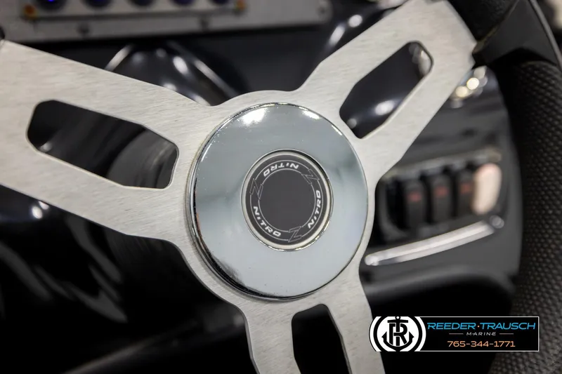 Slide: The Image of Steering wheel of 2021 Ntiro Z17 boat, featuring sleek metallic design. - 30