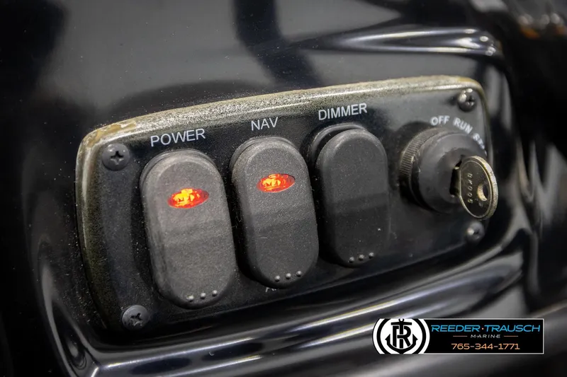 Slide: The Image of Control panel of a 2021 Ntiro Z17 boat with illuminated switches and ignition key. - 31