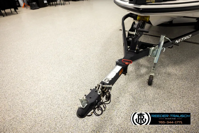Slide: The Image of Trailer hitch of a 2021 Ntiro Z17 boat in showroom, Reeder-Trausch Marine logo visible. - 50