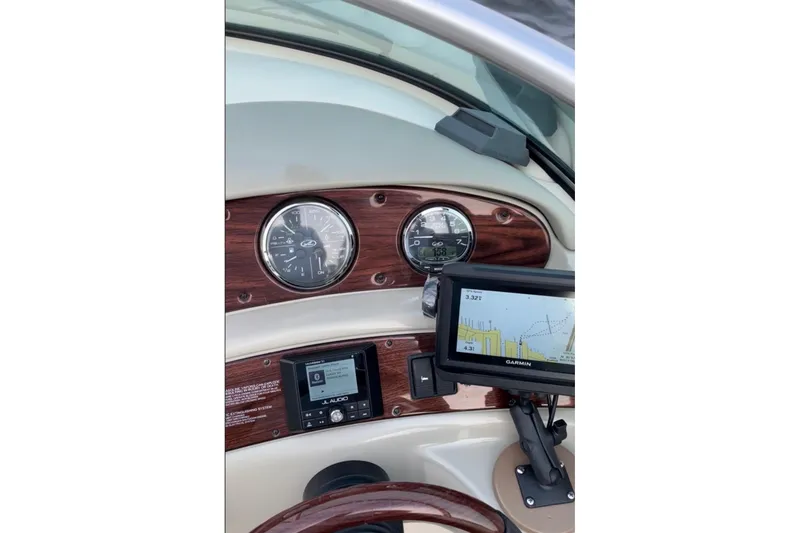 Slide: The Image of Dashboard of a 2006 Sea Ray 240 Sundeck with Garmin navigation system. - 7