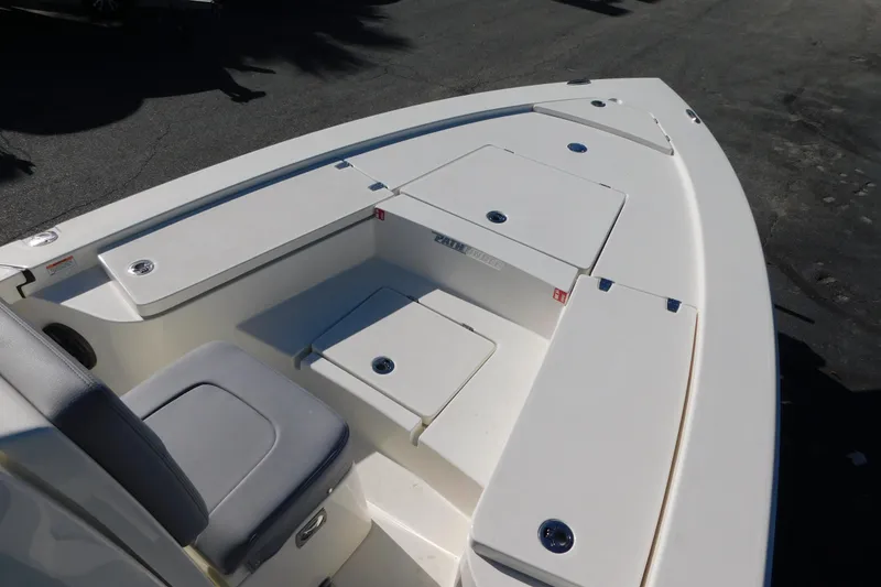 Slide: The Image of 2026 Pathfinder 2300 HPS boat interior with seating and storage compartments. - 10