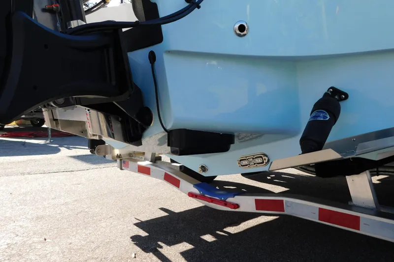 Slide: The Image of 2026 Pathfinder 2300 HPS boat on trailer, rear view, highlighting hull and trailer details. - 14