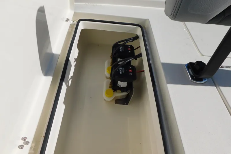 Slide: The Image of 2026 Pathfinder 2300 HPS boat storage compartment with dual battery setup. - 17