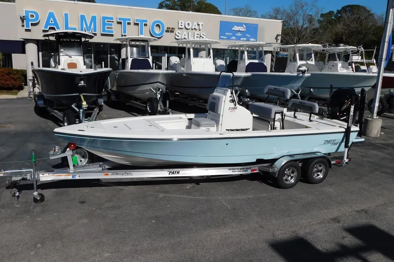Slide: The Image of 2026 Pathfinder 2300 HPS boat on trailer at Palmetto Boat Sales dealership. - 19