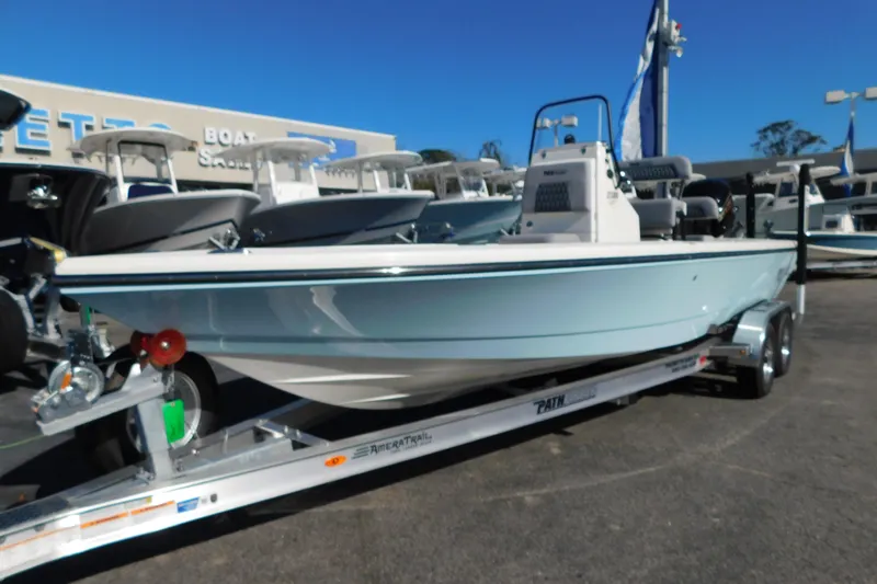 Slide: The Image of 2026 Pathfinder 2300 HPS boat on trailer at dealership, side view. - 2