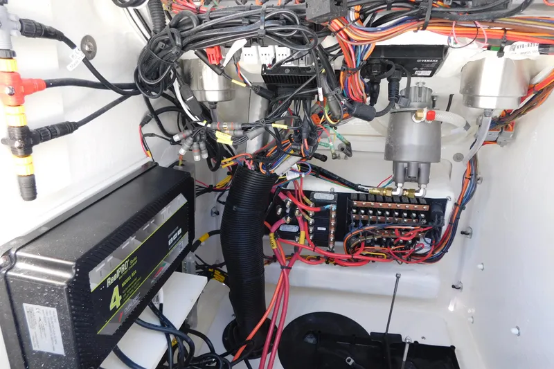 Slide: The Image of Electrical wiring and components inside a 2026 Pathfinder 2300 HPS boat. - 22