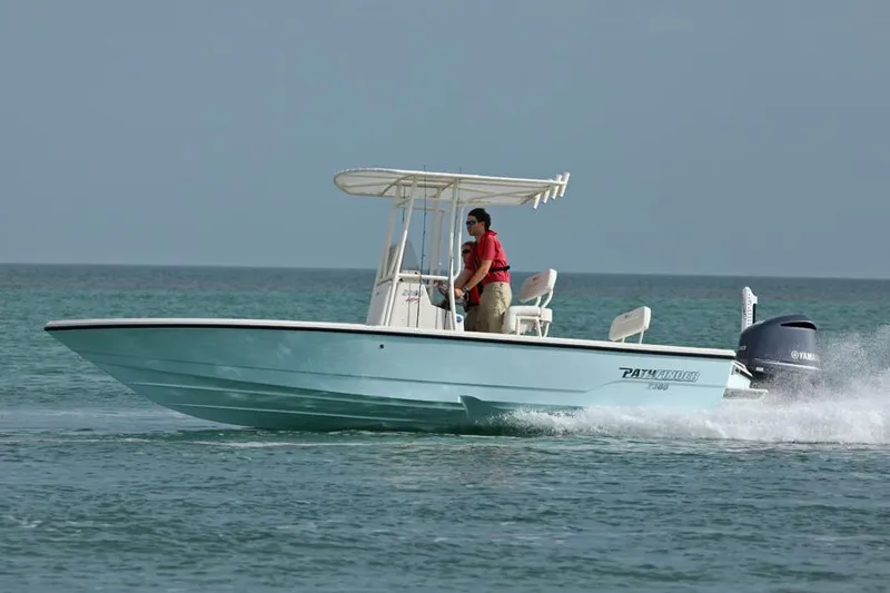 Slide: The Image of Manufacturer Provided Image: 2026 Pathfinder 2300 HPS boat cruising on open water with driver. - 30