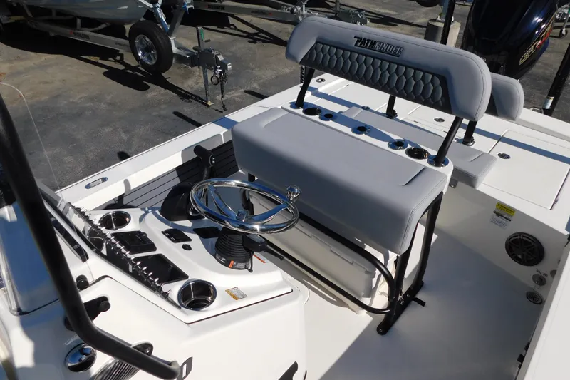 Slide: The Image of 2026 Pathfinder 2300 HPS boat interior with steering wheel and seating. - 7