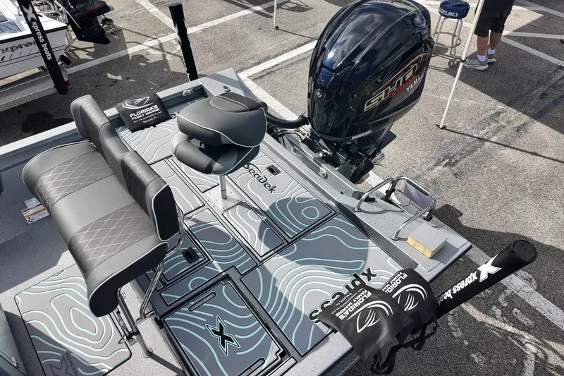 Slide: The Image of 2026 Xpress H24B Bay boat with Yamaha engine, featuring stylish seating and modern design. - 11