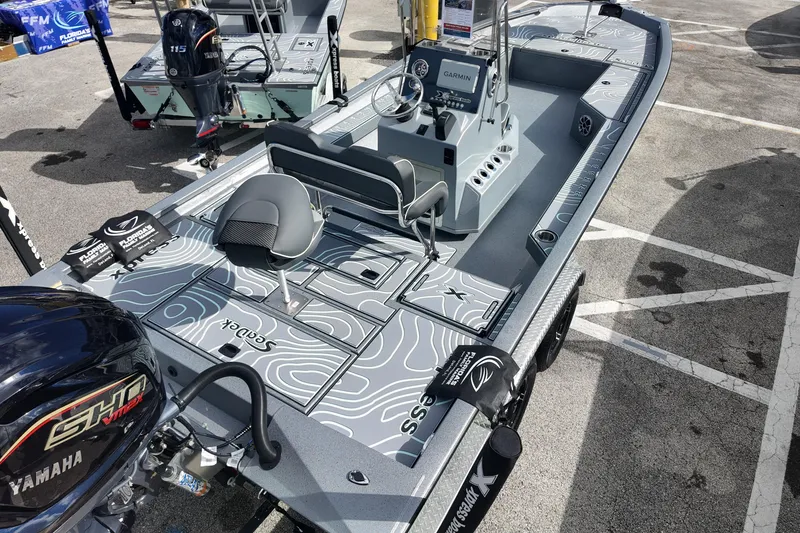 Slide: The Image of 2026 Xpress H24B Bay boat with Yamaha engine, featuring a sleek design and advanced navigation system. - 4