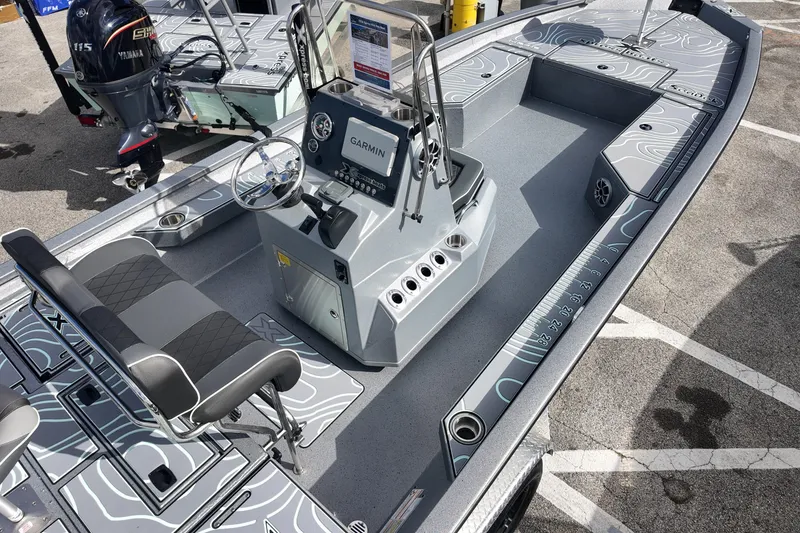 Slide: The Image of 2026 Xpress H24B Bay boat with Yamaha engine and Garmin navigation system. - 5