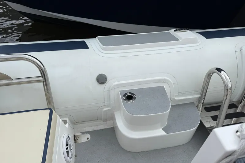 Slide: The Image of 2024 Novurania Catamaran 20 boat interior with seating and stainless steel ladder. - 12