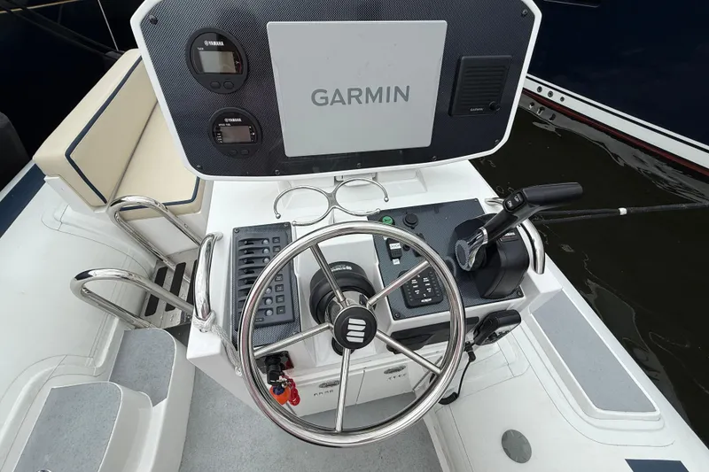 Slide: The Image of 2024 Novurania Catamaran 20 helm with Garmin navigation and Yamaha controls. - 15
