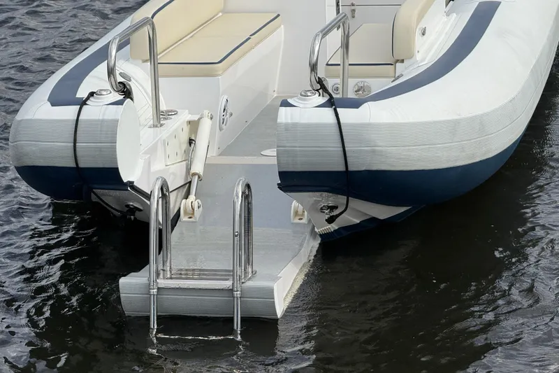 Slide: The Image of 2024 Novurania Catamaran 20 with swim ladder on calm water. - 5