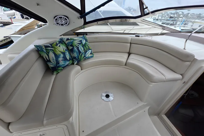 Slide: The Image of Luxurious seating area on 2002 Regal Commodore 4260 yacht with tropical cushions. - 28