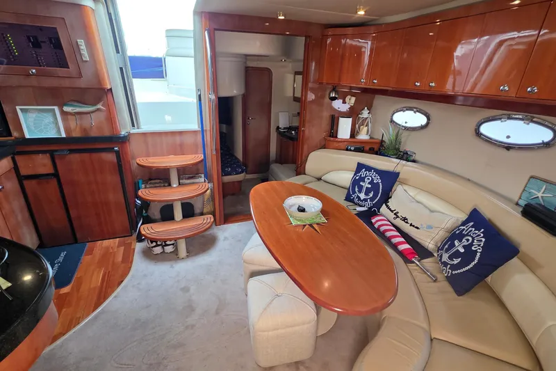 Slide: The Image of Luxurious interior of 2002 Regal Commodore 4260 yacht with elegant wood finishes. - 36
