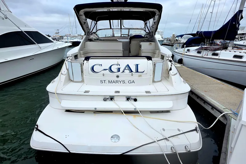 Slide: The Image of 2002 Regal Commodore 4260 yacht docked at marina, named "C-GAL," St. Marys, GA. - 4