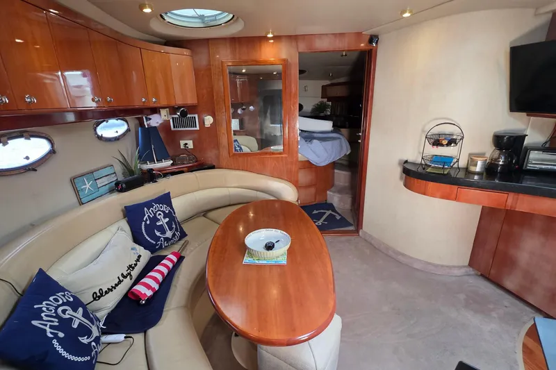 Slide: The Image of Luxurious 2002 Regal Commodore 4260 yacht interior with elegant seating and nautical decor. - 50