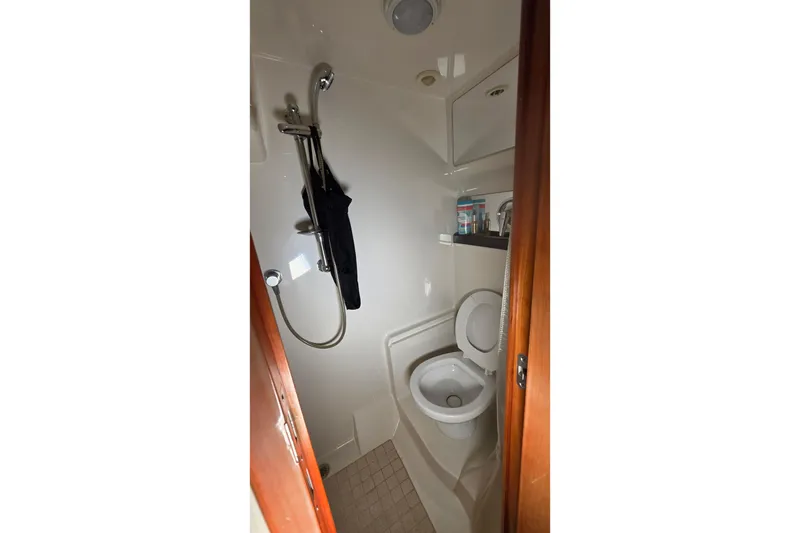 Slide: The Image of 2002 Regal Commodore 4260 yacht bathroom with shower and toilet. - 51