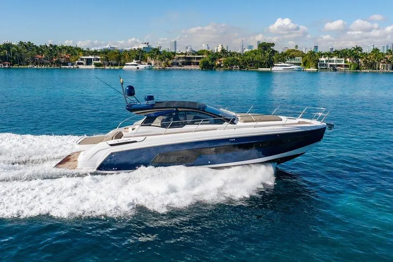 The Image of 2022 Azimut Atlantis 45 yacht cruising on a sunny day in a scenic coastal area. - 0