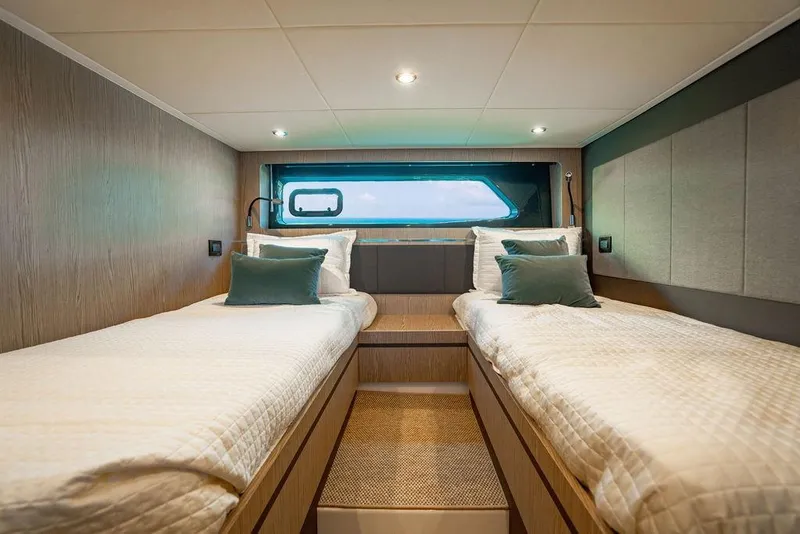 Slide: The Image of Luxurious cabin interior of 2022 Azimut Atlantis 45 yacht with twin beds and modern decor. - 14