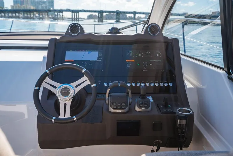 Slide: The Image of 2022 Azimut Atlantis 45 yacht helm with advanced navigation system and steering wheel. - 17