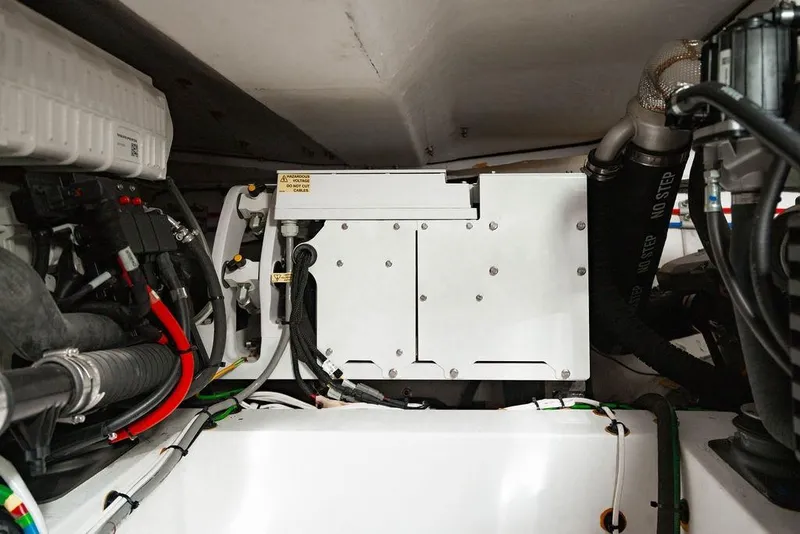 Slide: The Image of Engine compartment of 2022 Azimut Atlantis 45 yacht, showcasing mechanical components and wiring. - 27