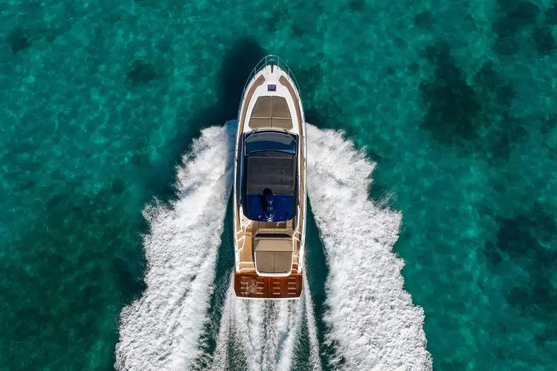 Slide: The Image of Azimut Atlantis 45 yacht cruising on clear turquoise waters, aerial view, 2022 model. - 31