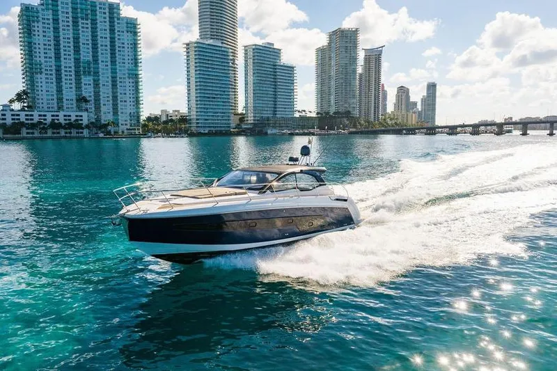 Slide: The Image of 2022 Azimut Atlantis 45 yacht cruising in sunny cityscape waters. - 32