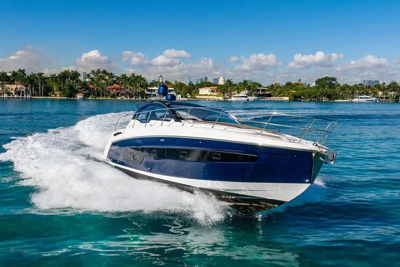 Slide: The Image of 2022 Azimut Atlantis 45 yacht cruising on clear blue water. - 4