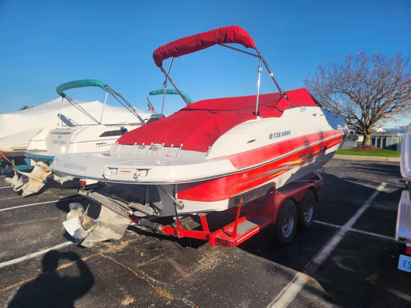 The Image of 2005 Four Winns 214 Funship boat with red cover on trailer. - 0