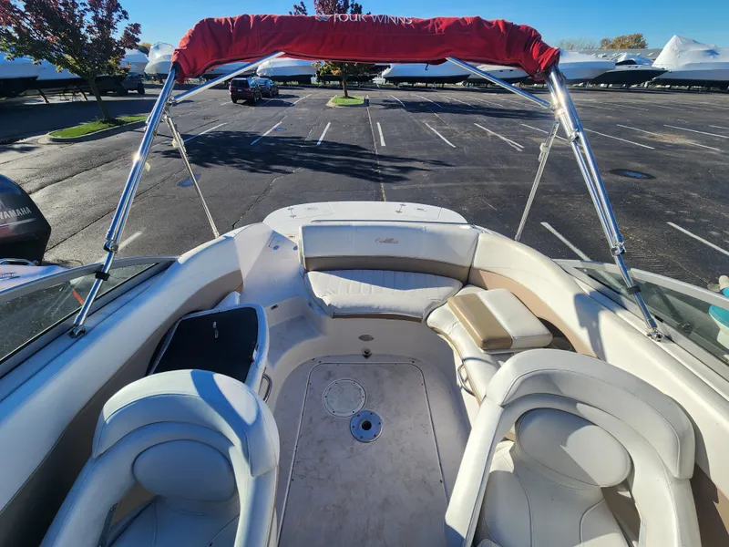 Slide: The Image of Interior of a 2005 Four Winns 214 Funship boat with red sunshade. - 14