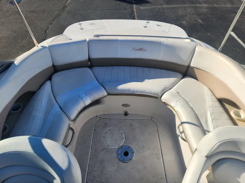 Slide: The Image of Interior of a 2005 Four Winns 214 Funship boat with seating area. - 16