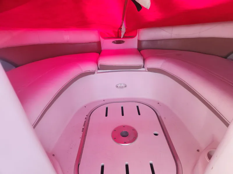 Slide: The Image of Interior of a 2005 Four Winns 214 Funship boat with red canopy. - 4