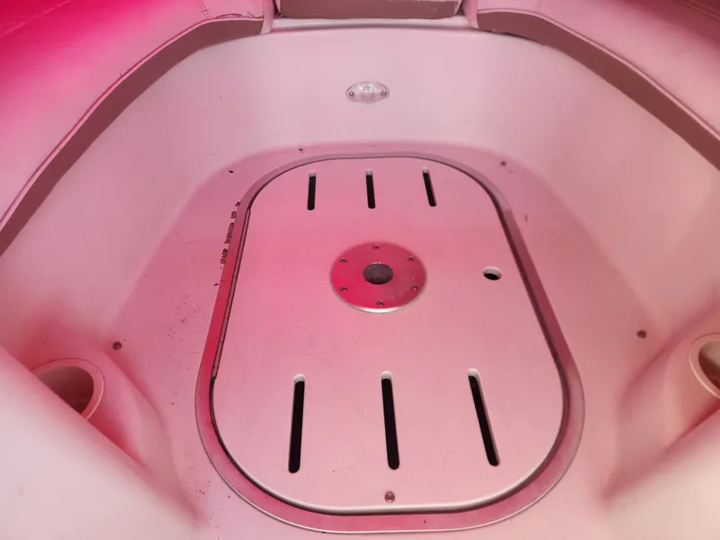 Slide: The Image of Interior of a 2005 Four Winns 214 Funship boat with red lighting. - 5