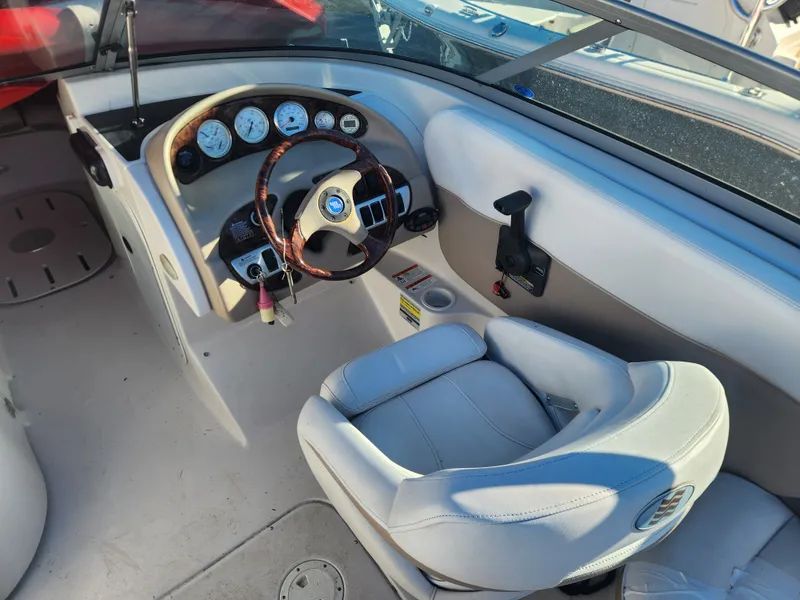 Slide: The Image of Interior of 2005 Four Winns 214 Funship boat with steering console. - 6