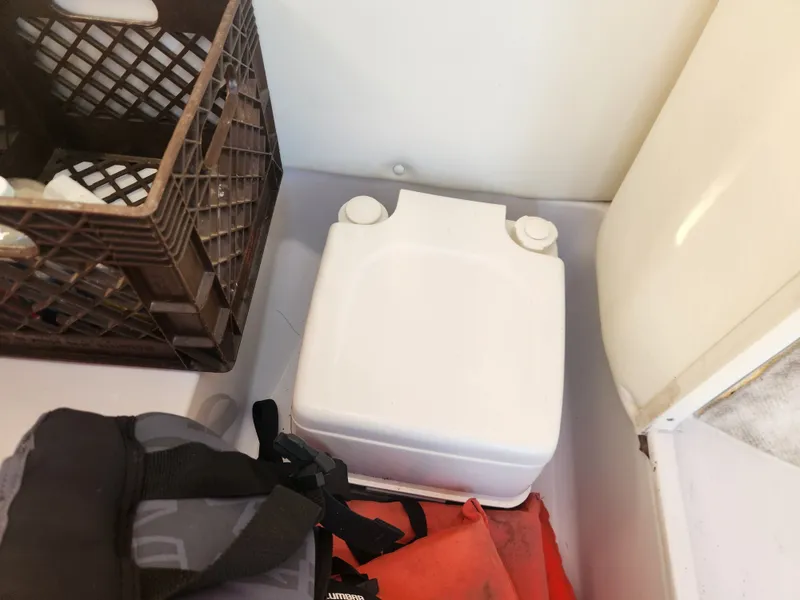 Slide: The Image of 2005 Four Winns 214 Funship boat accessories in storage compartment. - 9