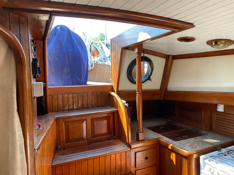 Slide: The Image of Interior of 1981 Hans Christian 38 Mark II sailboat with wooden cabinetry and nautical decor. - 13