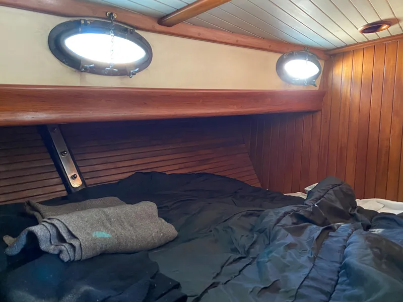 Slide: The Image of Cozy cabin interior of 1981 Hans Christian 38 Mark II sailboat with wooden paneling. - 17