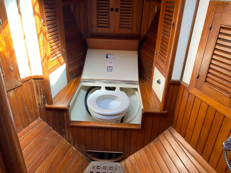 Slide: The Image of Wood-paneled marine bathroom in 1981 Hans Christian 38 Mark II sailboat. - 22